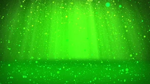 Shiny green particles or glitters fall and settle on the surface. Background or Video stock 81488339