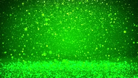 Shiny green particles or glitters fall and settle on the rotating surface Video stock 81724463