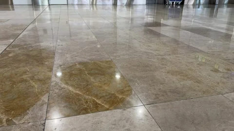 Shiny marble floor reflecting walking passengers in a terminal Vídeo Stock 344572016
