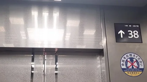 Shiny metal elevator display showing numbers increasing as the lift ascends Stock Footage 337196786