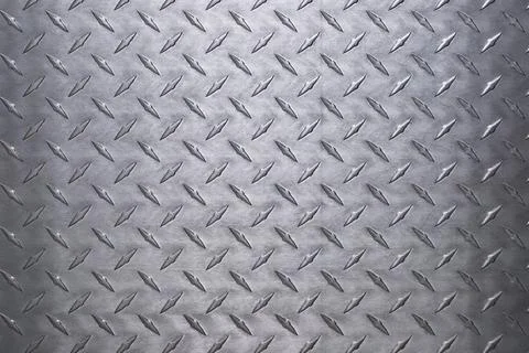 Shiny metal texture with diamond pattern. stainless steel background Stock Photos