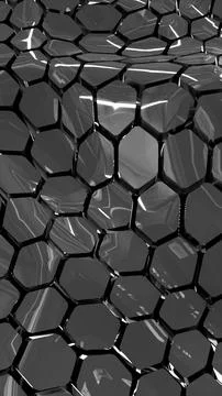 Shiny metallic geometric surface with hexagonal reflective shapes in black .. Stock Photos