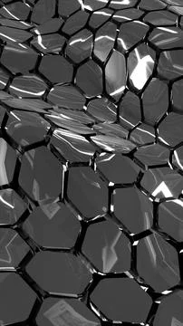 Shiny metallic geometric surface with hexagonal reflective shapes in black .. Stock Photos