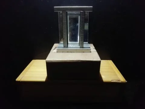 A Shiny metallic object with a dark background Stock Photos
