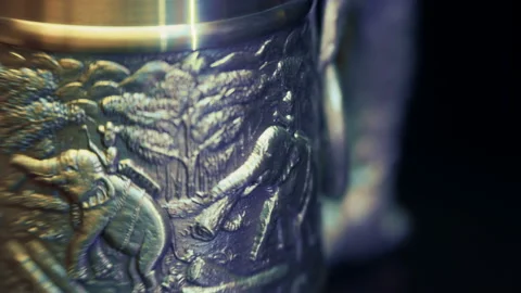 Shiny metallic Thai mug, with elephants who working in the jungle is rotates  Stock Footage 120731441