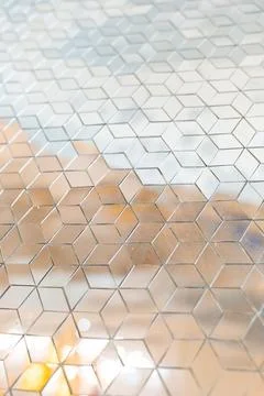 Shiny mirror cut in a cube shape for decorating wall Stock-Fotos
