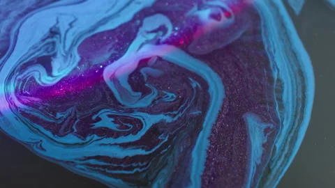 Shiny paint flow floating ink texture neon water Stock Footage 316907418