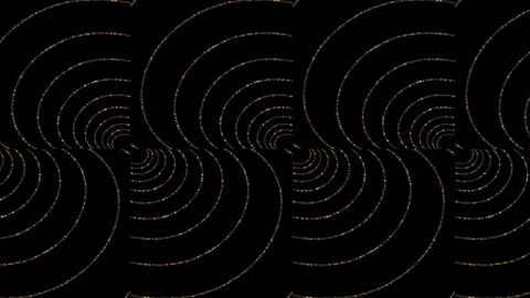 A shiny pattern of rounded golden lines moves against a dark background Stock Footage 327672085