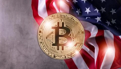 Shiny Physical Bitcoin Against Official United States Flag waved on a grunge Stock Photos