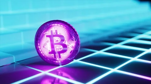 Shiny physical bitcoin spinning on a reflective surface with glowing purple and Stock Footage 334043587