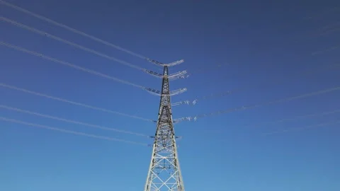 Shiny power cables against the blue sky on a sunny summer day Stock Footage 344796883