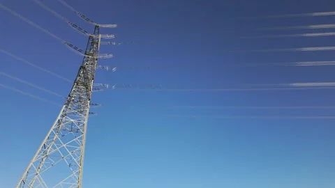 Shiny power cables against the clear blue sky Stock Footage 344796706