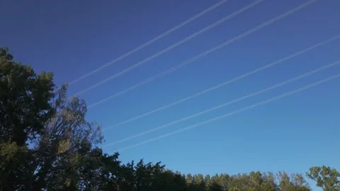 Shiny power cables between high-voltage towers against the blue sky Stock Footage 344795928