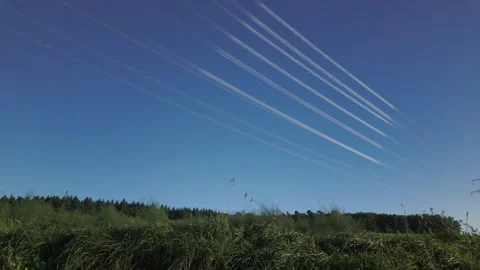 Shiny power cables between high-voltage towers against the blue sky Stock Footage 344796747