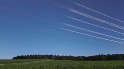 Shiny power cables between high-voltage towers against the clear blue sky Stock Footage 344797031