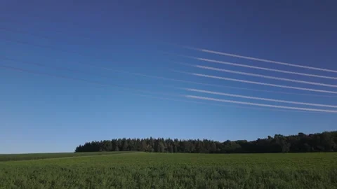 Shiny power cables between two high-voltage tower against the clear blue sky Stock Footage 344796989