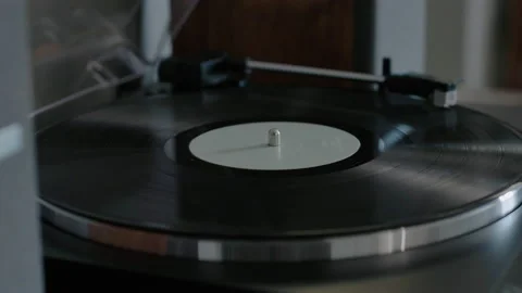 Shiny record spins on record player 動画素材 169063722