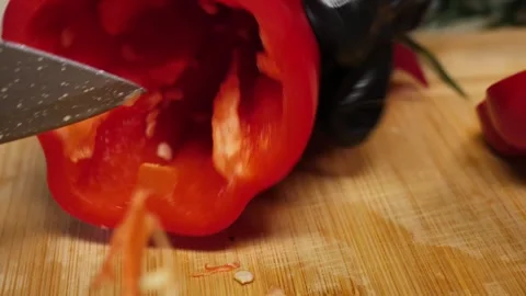 Shiny Red Peppers: Core and Seed Removal in Detail Stock Footage 311894483