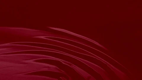 Shiny red satin falling down in slow motion ripples Stock Footage 100721543