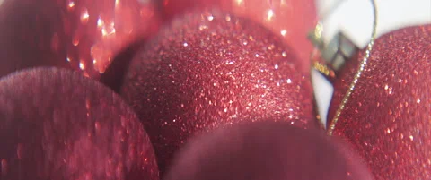 Shiny red sequined baubles close-up 4K scope sliding video Stock Footage 316876847