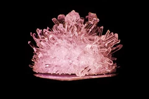 Shiny red sharp ruby crystal highlighted and isolated on black background 스톡 사진