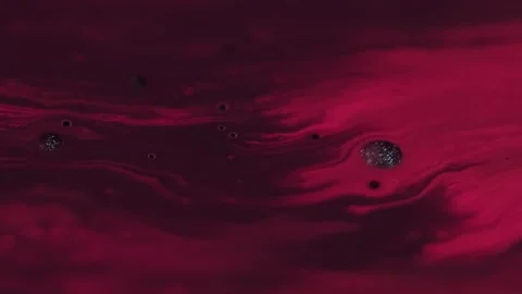 Shiny round particles drip background paint oil Video stock 320461998