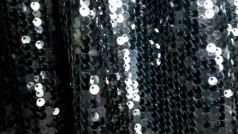Shiny sequins fabric glowing in the dark. Abstract dark Video stock 292371581