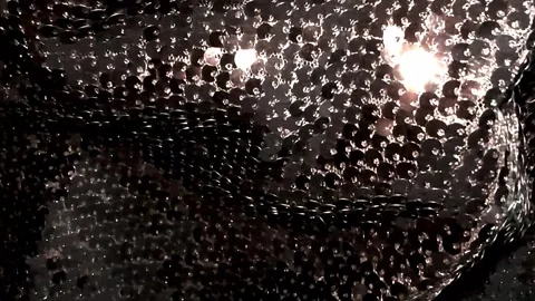 Shiny sequins fabric glowing in the dark. Abstract dark Video stock 292371586