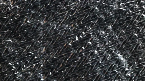 The shiny silver background is out of focus. Soft focus, real time, close-up, ca Stock Footage 129146960