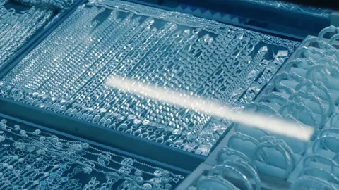 Shiny silver bracelets chains are lying in a row on the display case  Stock Footage 318694657