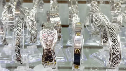 Shiny silver bracelets display intricate designs Stock-Footage 344906052
