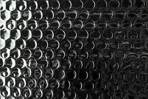Shiny silver foil surface with round impressions for textured background. Foto stock