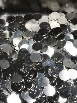 Shiny Silver Metallic Sequeins or Round Confetti Discs Background Close Up Stock Photos