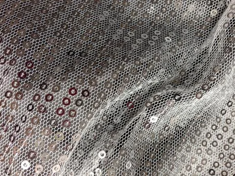 Shiny silver sequin fabric with texture Stock Photos
