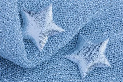 Shiny silver star on gray texture cloth Stock Photos