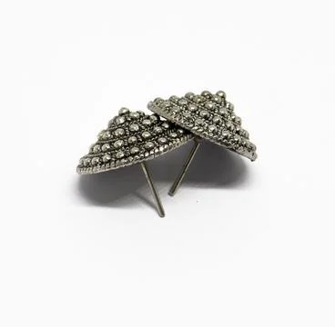 Shiny Silver Stud Earrings with Small Metal Spheres on White Background Fotos Stock