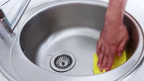 Shiny Sink in Seconds: Quick Clean with Soft Yellow Cloth Swipe Stock Footage 313583235