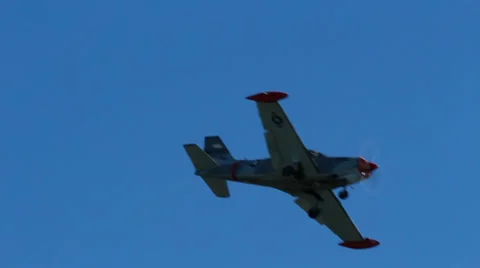 Shiny small airplane flying at camera and landing Stock-Footage 34553967