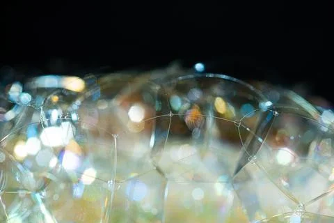 Shiny soap bubbles reflecting light. Stock Photos