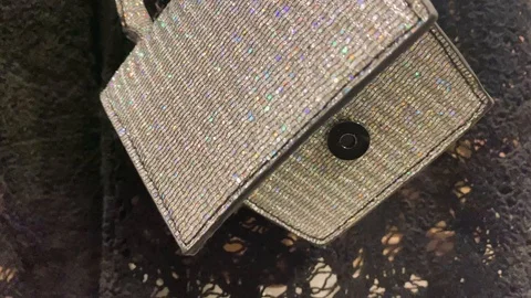 Shiny sparkle sequin opened silver bag. Lace black  Party dress in the store Video stock 121060674