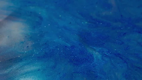 Shiny spatter blue ink wave sparkling particles Video stock 318503396