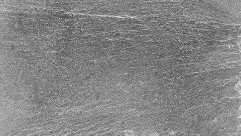 Shiny stone embossed background in dark gray color Stock Photos