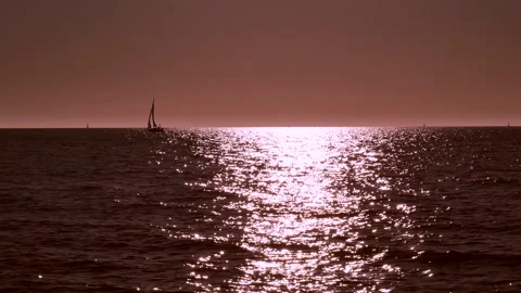 Shiny sun reflections. Sparkling sea water. Ocean waves. Sailboat. Real time. Stock Footage 155332503