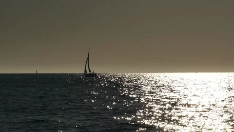 Shiny sun reflections. Sparkling sea water. Ocean waves. Sailboat. Real time. Stock Footage 155332618