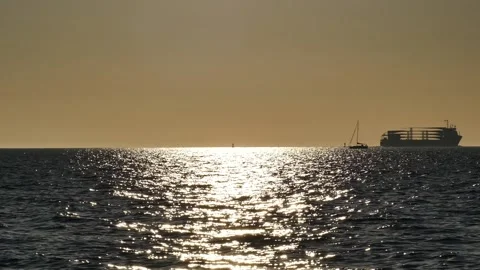 Shiny sun reflections. Sparkling sea water. Ocean waves. Ships. Real time. Stock Footage 155376843