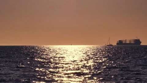 Shiny sun reflections. Sparkling sea water. Ocean waves. Ships. Real time. Stock Footage 155376849