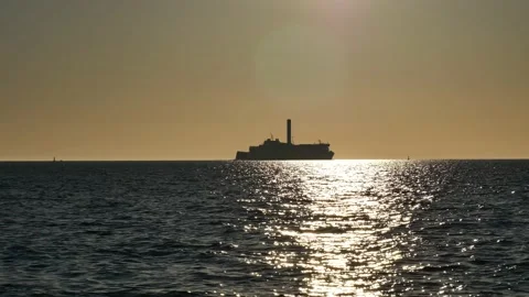Shiny sun reflections. Sparkling sea water. Ocean waves. Ships. Real time. Stock Footage 155381541
