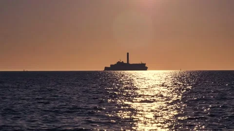 Shiny sun reflections. Sparkling sea water. Ocean waves. Ships. Real time. Stock Footage 155381550