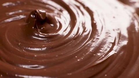 Shiny surface of chocolate hazelnut butter rotates Stock Footage 230180499