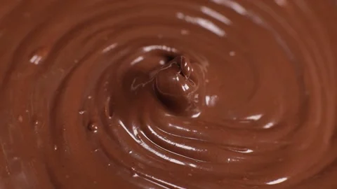 Shiny surface of chocolate hazelnut butter rotates Stock Footage 230181557